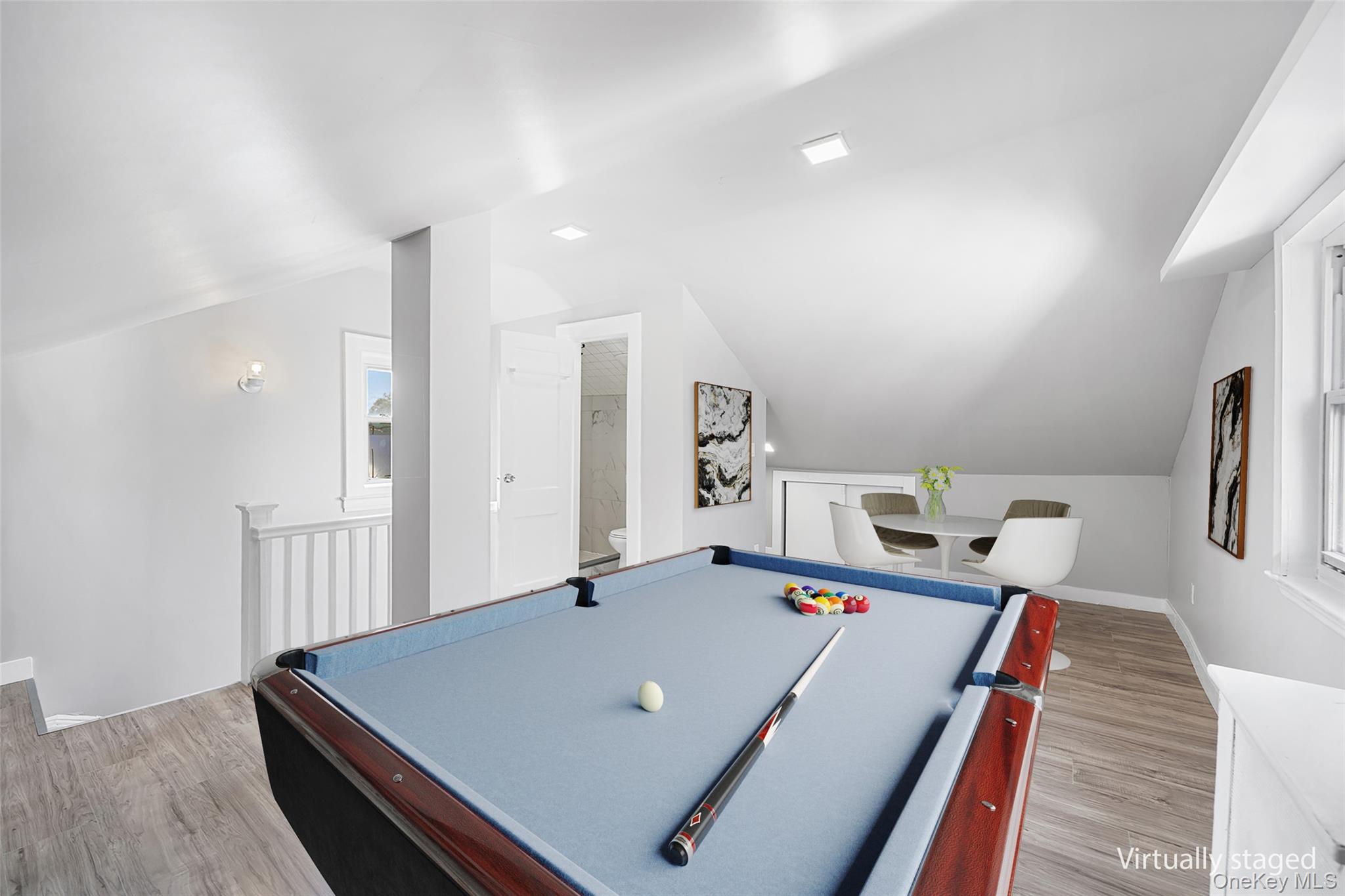 150-44 87th Road Queens, NY 11432 - Photo 22 of 35 a living room with hard wood flooring and a table