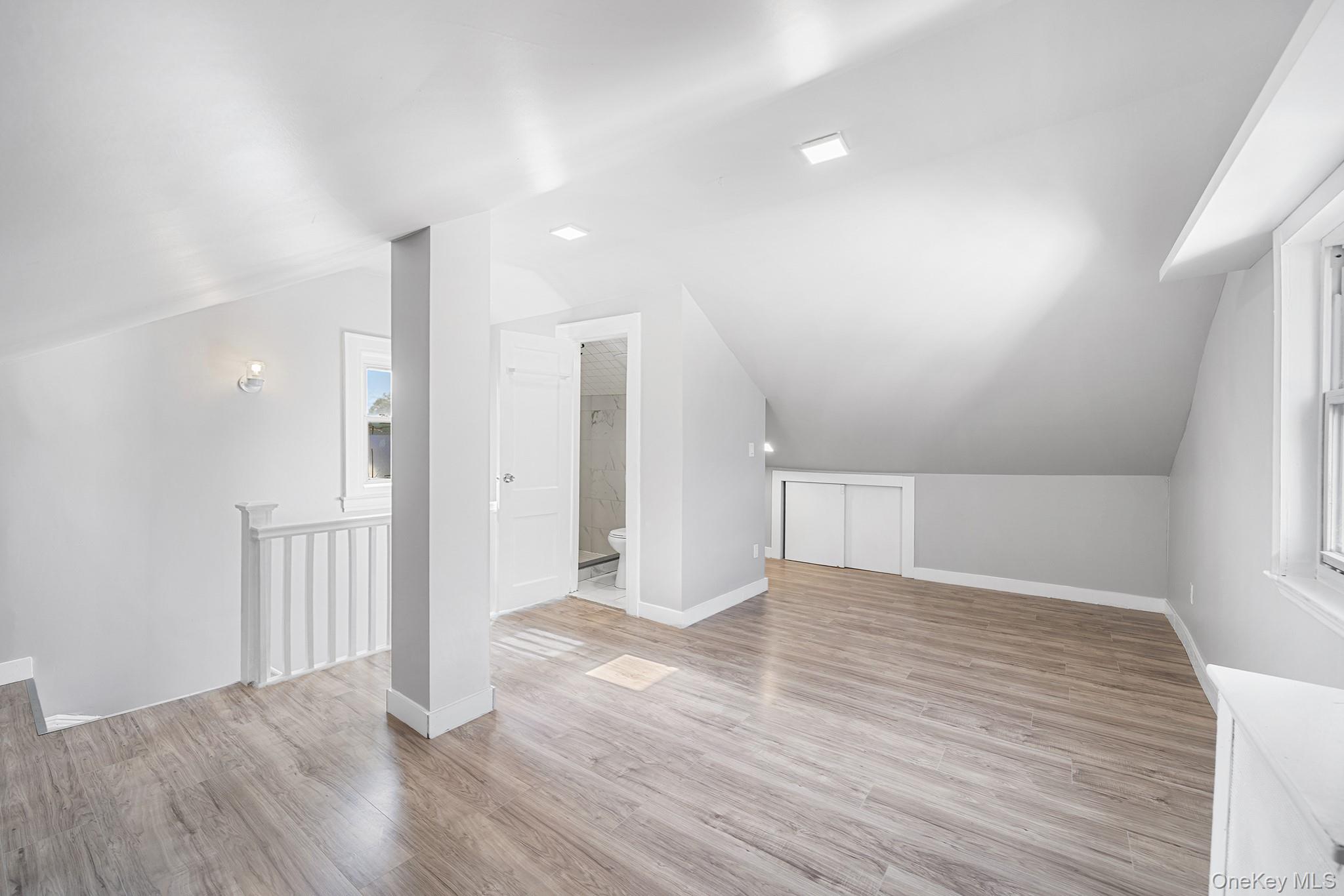 150-44 87th Road Queens, NY 11432 - Photo 23 of 35 a view of an empty room with wooden floor