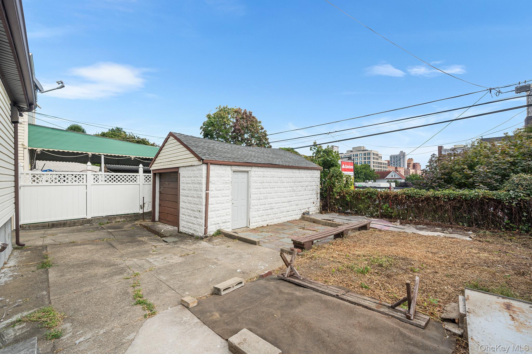 150-44 87th Road Queens, NY 11432 - Photo 33 of 35 a view of a house with backyard