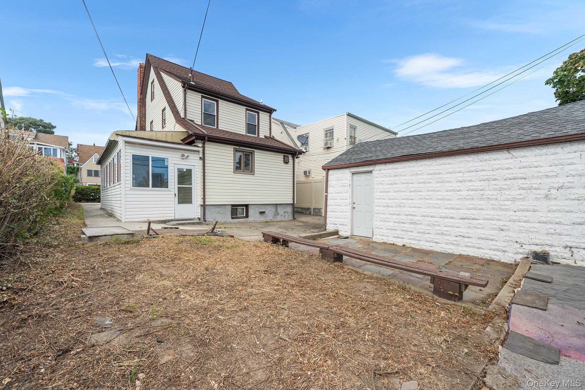 150-44 87th Road Queens, NY 11432 - Photo 34 of 35 a house with trees in the background