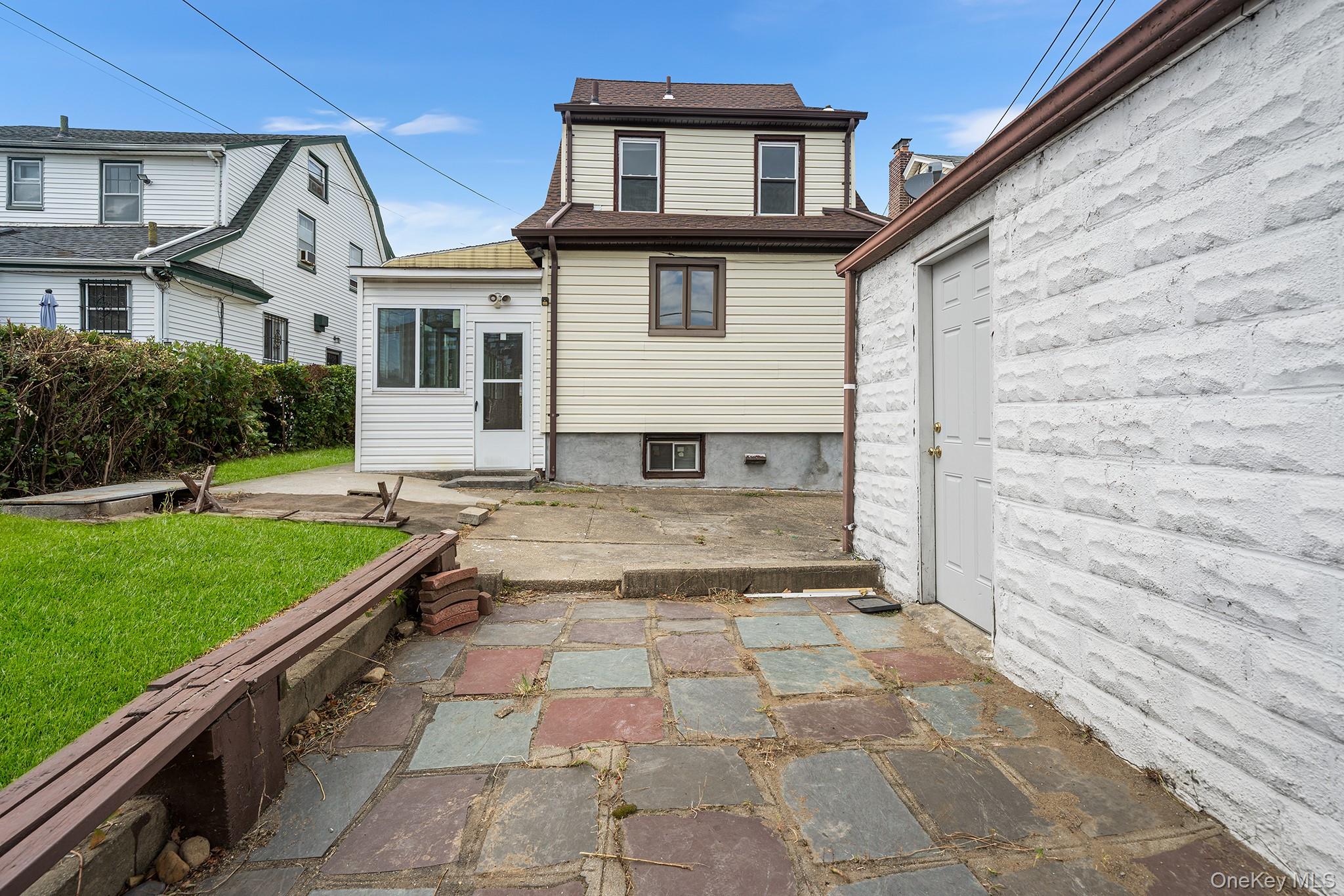 150-44 87th Road Queens, NY 11432 - Photo 35 of 35 a view of a house with a yard