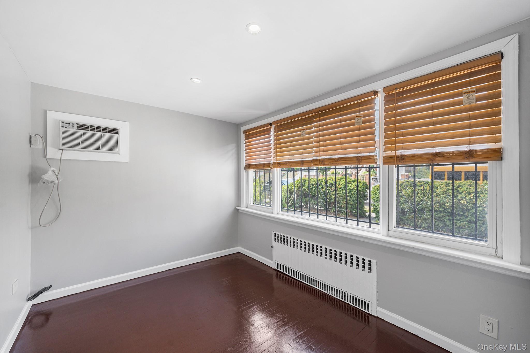 150-44 87th Road Queens, NY 11432 - Photo 4 of 35 a view of an empty room with a window