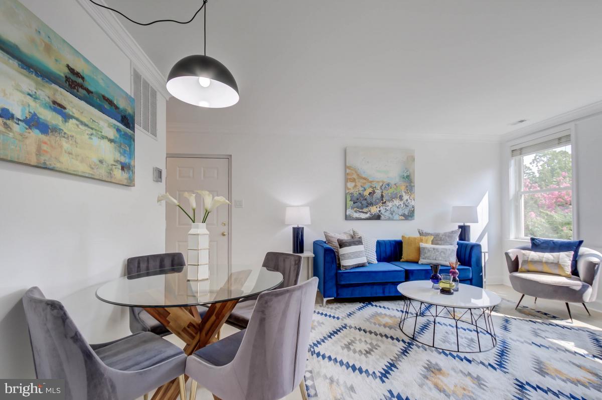 1201 O Street Northwest, Unit 2A Washington, DC 20005 - Photo 15 of 31 a living room with furniture and a table