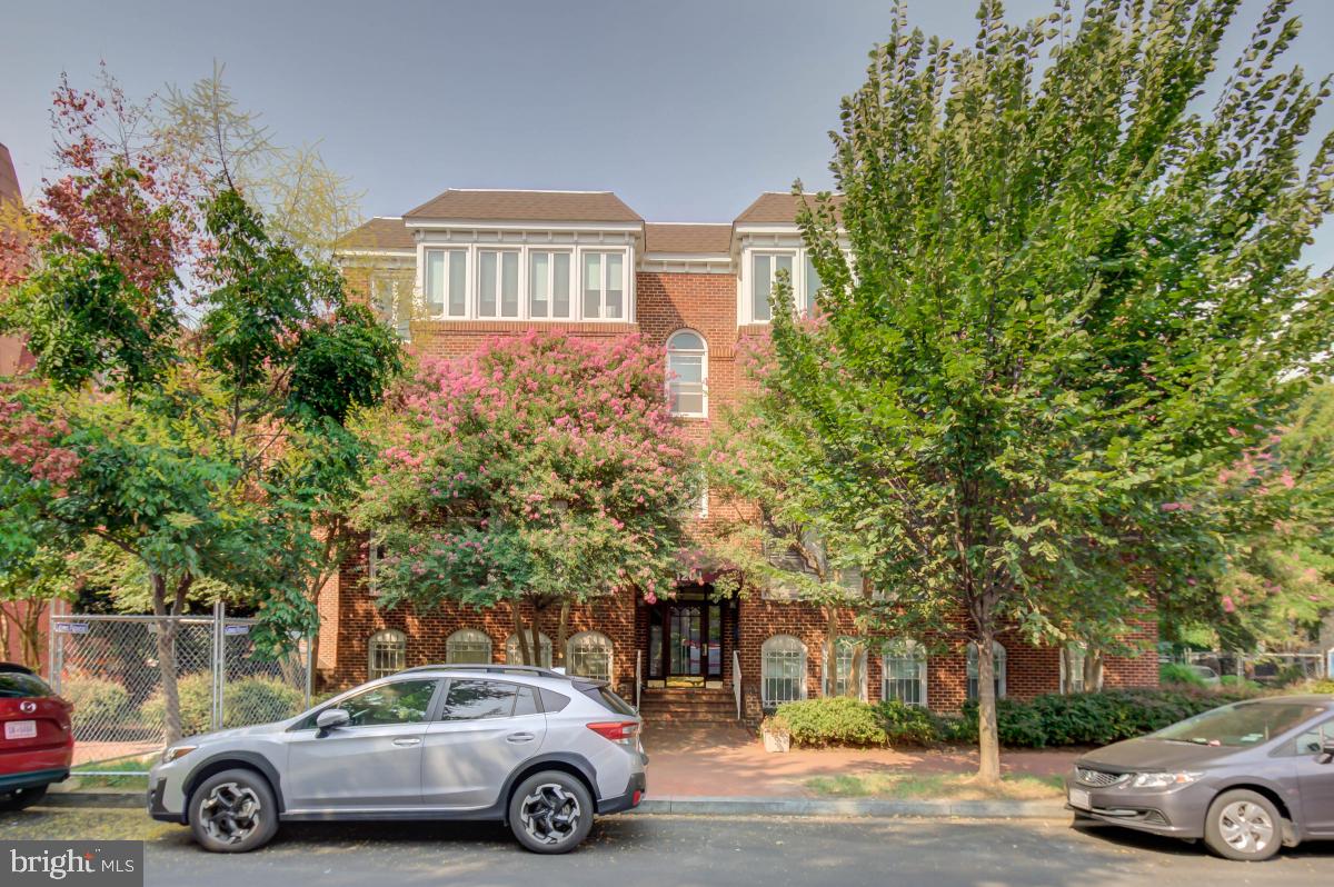 1201 O Street Northwest, Unit 2A Washington, DC 20005 - Photo 3 of 31 a car parked in front of a house