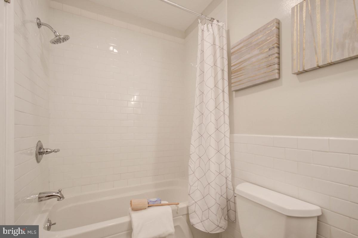 1201 O Street Northwest, Unit 2A Washington, DC 20005 - Photo 21 of 31 a bathroom with a toilet and a shower