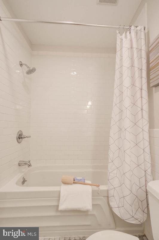 1201 O Street Northwest, Unit 2A Washington, DC 20005 - Photo 22 of 31 a bathroom with a shower and a bathtub