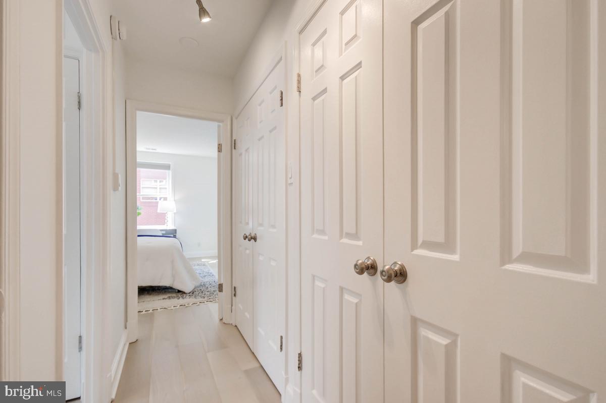 1201 O Street Northwest, Unit 2A Washington, DC 20005 - Photo 23 of 31 a view of a hallway with a hardwood floor and a bathroom