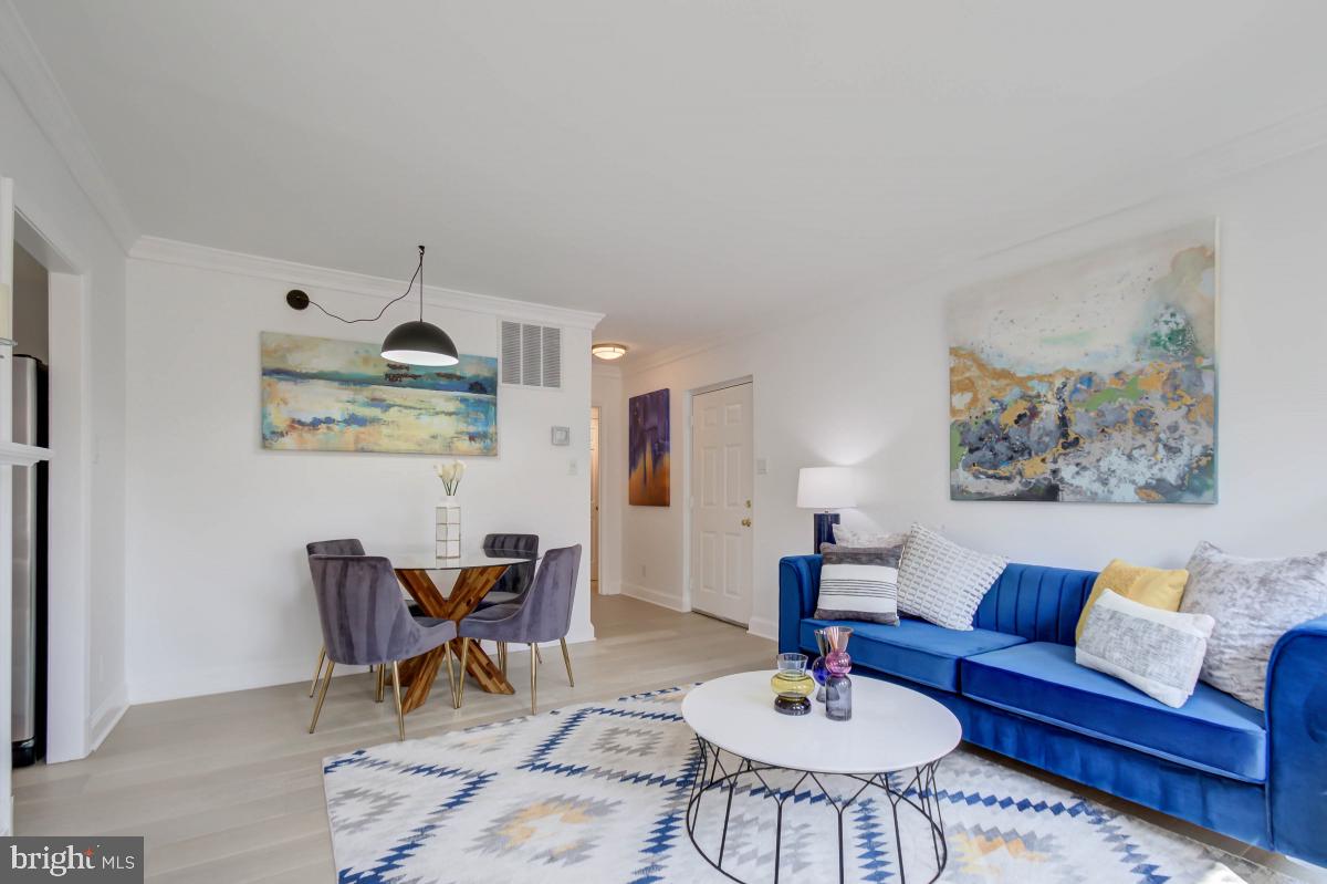 1201 O Street Northwest, Unit 2A Washington, DC 20005 - Photo 8 of 31 a living room with furniture and kitchen view