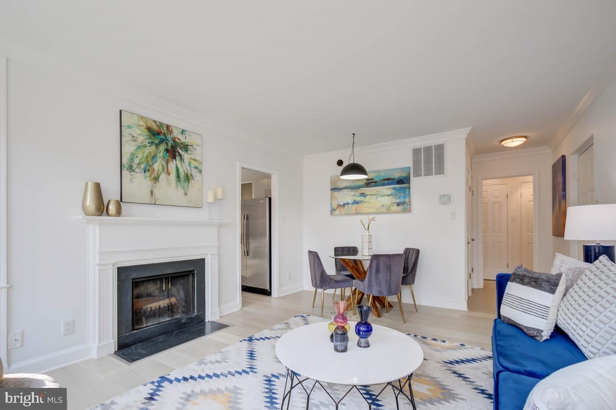 1201 O Street Northwest, Unit 2A Washington, DC 20005 - Photo 9 of 31 a living room with furniture and a fireplace
