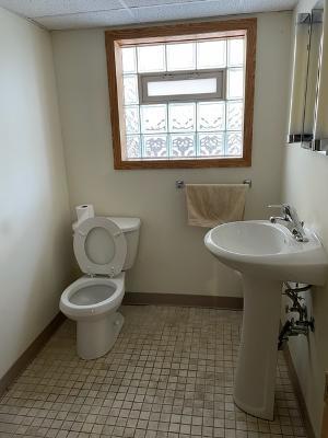6130 West Patterson Avenue Chicago, IL 60634 - Photo 14 of 16 a bathroom with a toilet a sink and a window