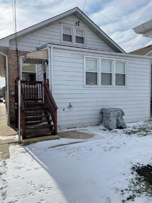 6130 West Patterson Avenue Chicago, IL 60634 - Photo 16 of 16 a view of a house with a snow on the road