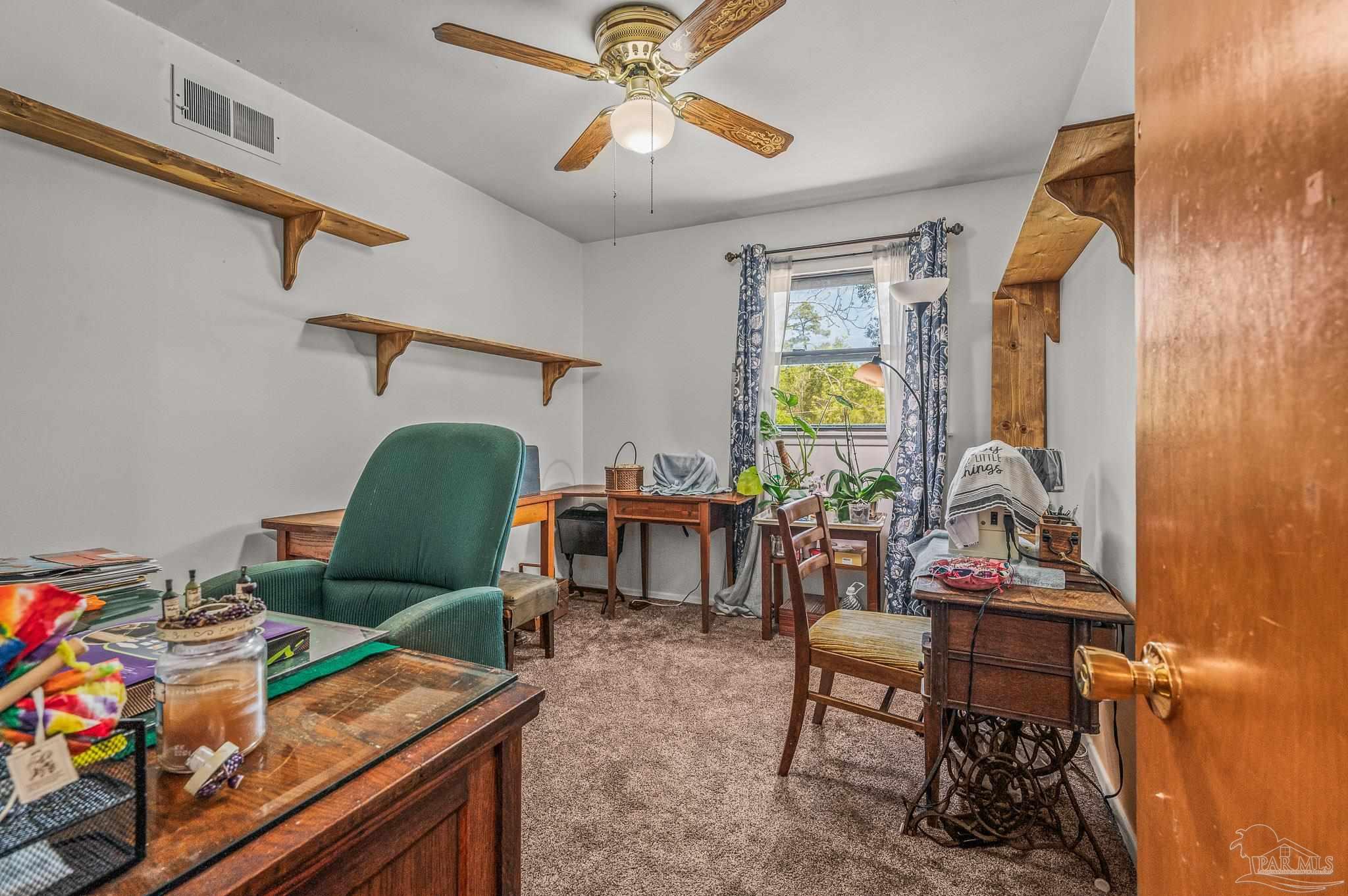 3015 Molino Road Molino, FL 32577 - Photo 19 of 35 a living room with furniture and a window