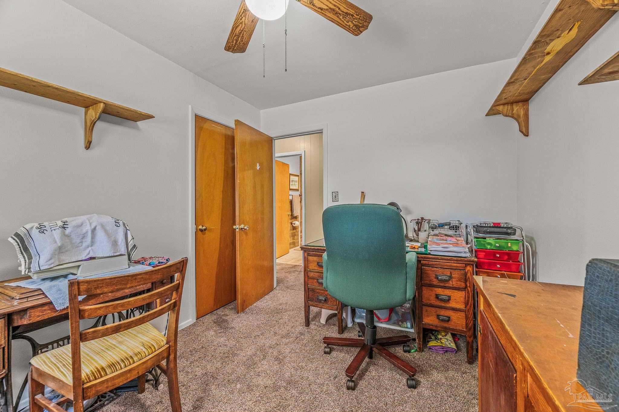 3015 Molino Road Molino, FL 32577 - Photo 20 of 35 a view of a workspace with furniture and a window