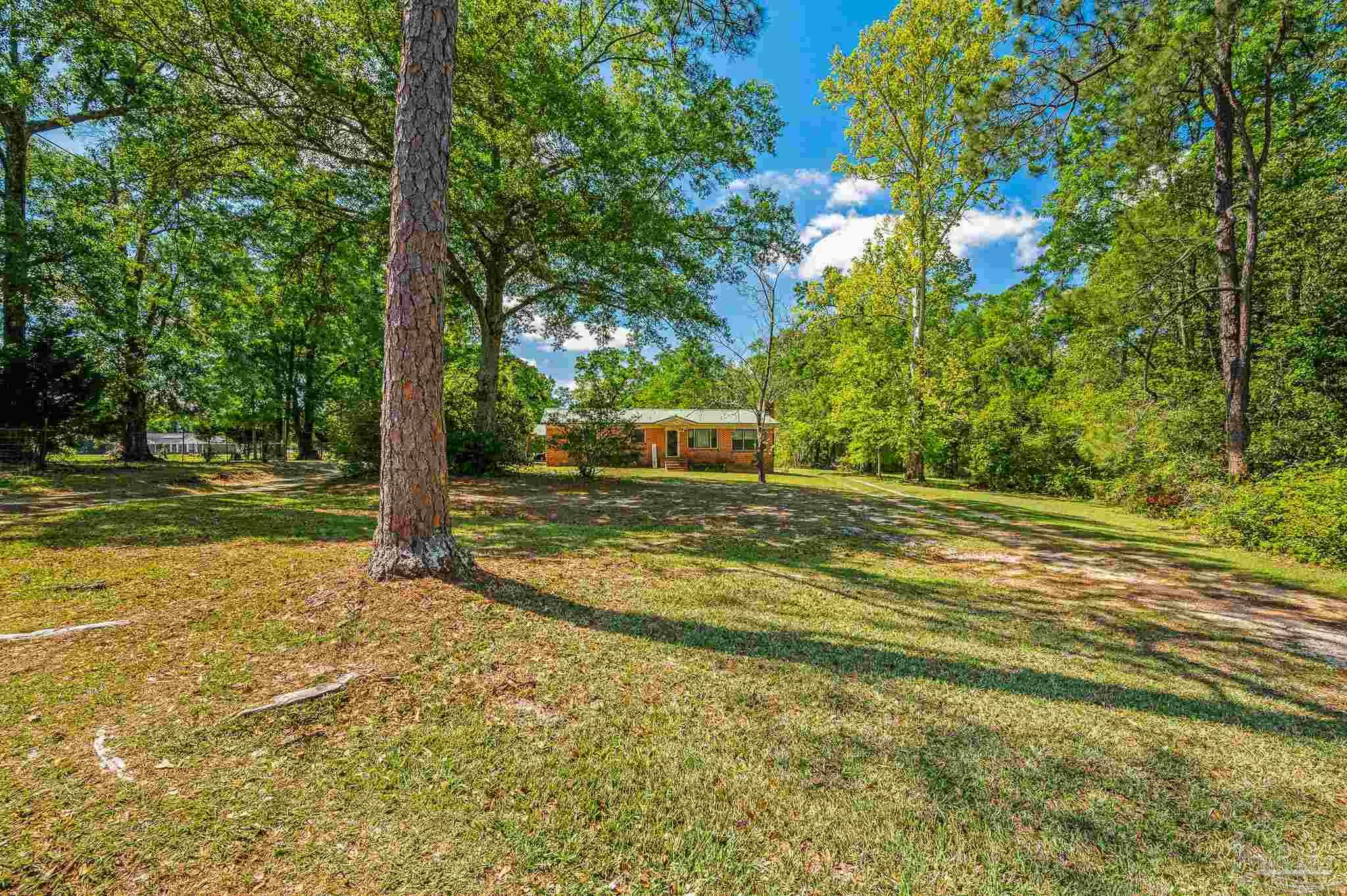3015 Molino Road Molino, FL 32577 - Photo 2 of 35 a view of a house with a yard