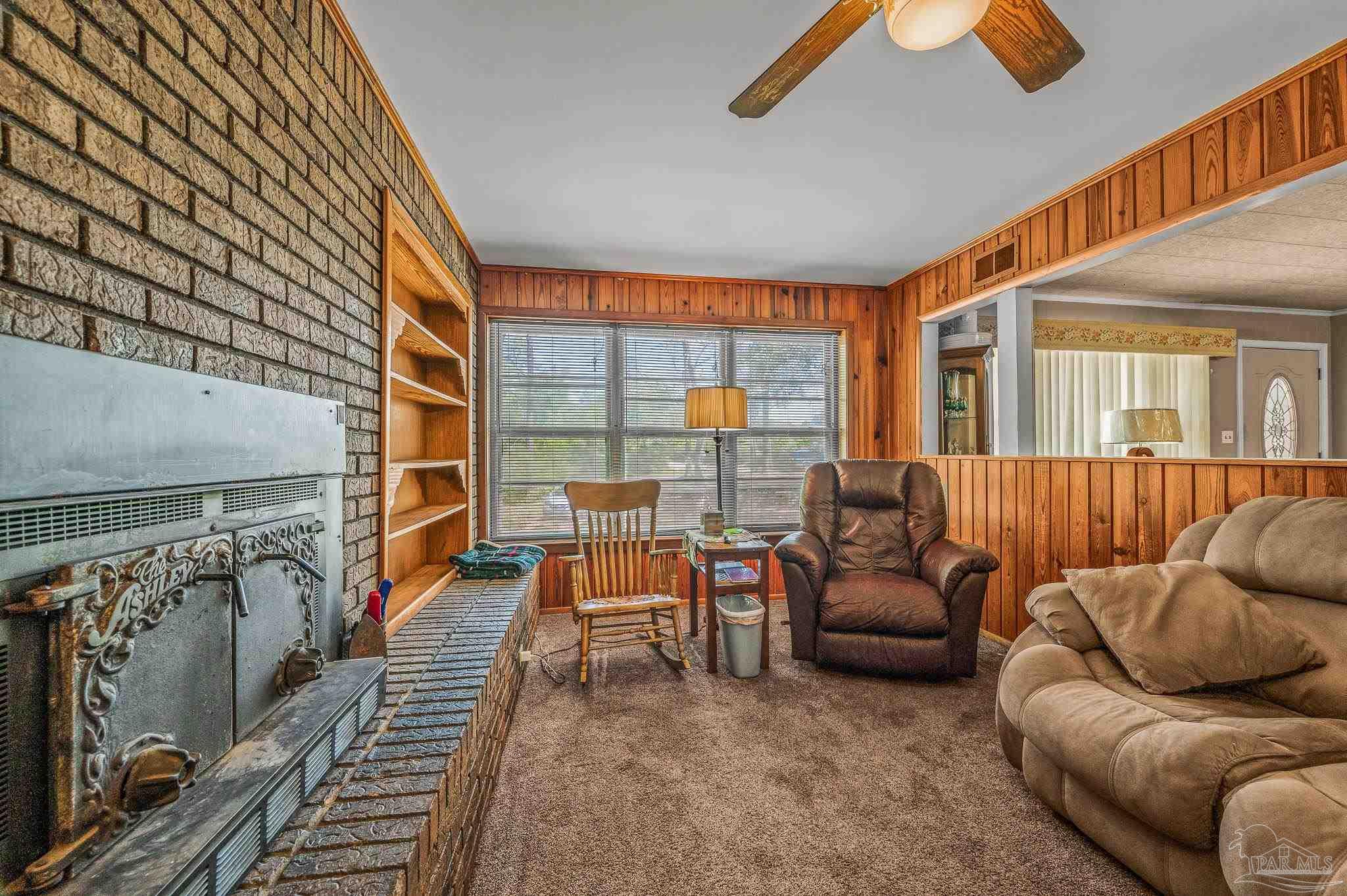 3015 Molino Road Molino, FL 32577 - Photo 24 of 35 a living room with furniture and a floor to ceiling window