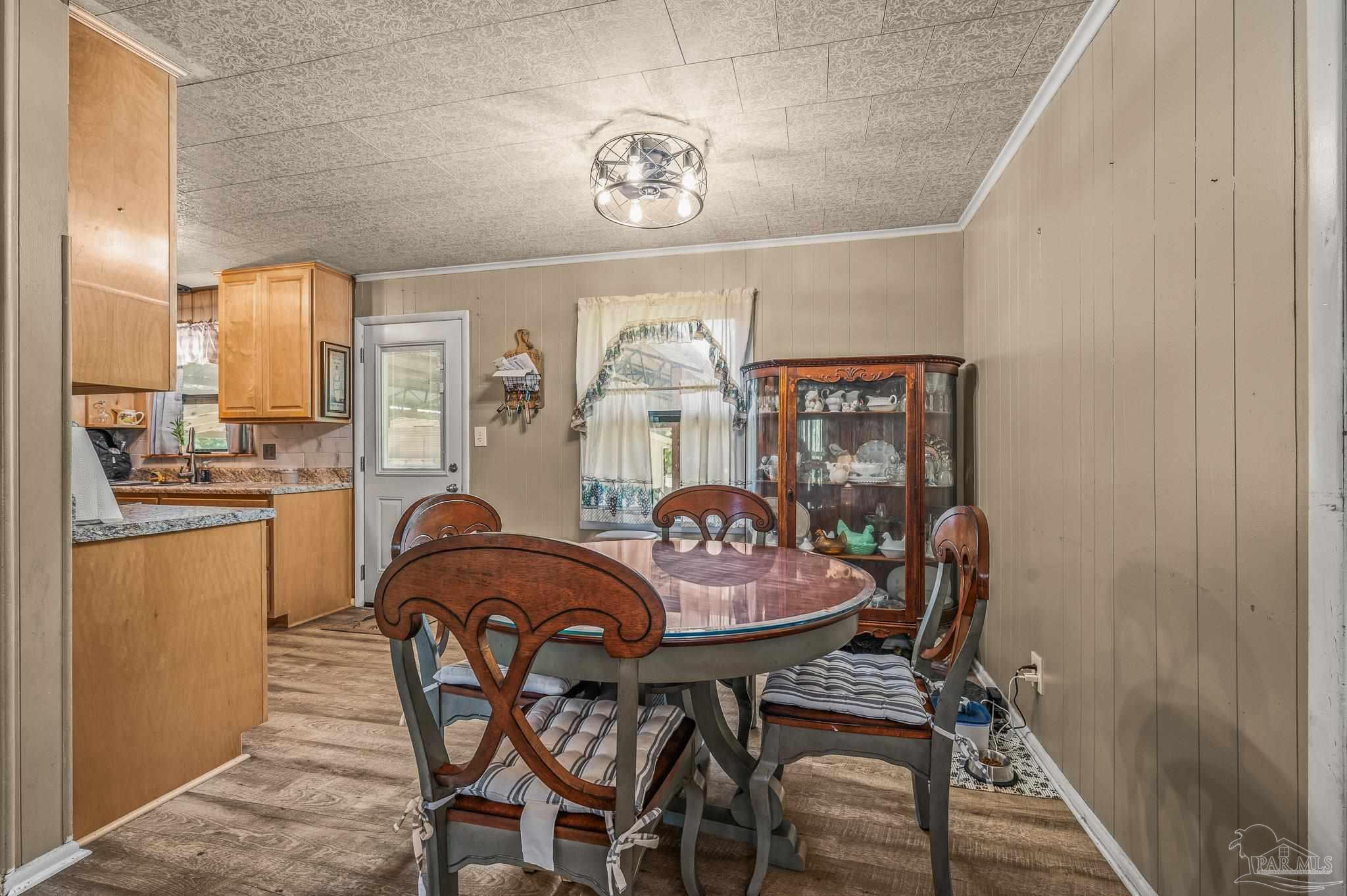 3015 Molino Road Molino, FL 32577 - Photo 30 of 35 a dining room with furniture and chandelier