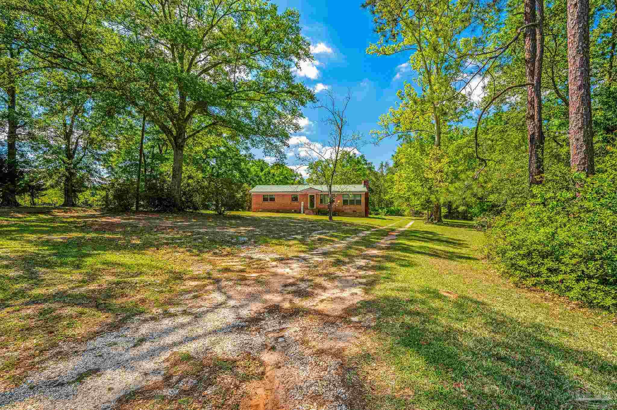 3015 Molino Road Molino, FL 32577 - Photo 3 of 35 a view of a pool with a yard