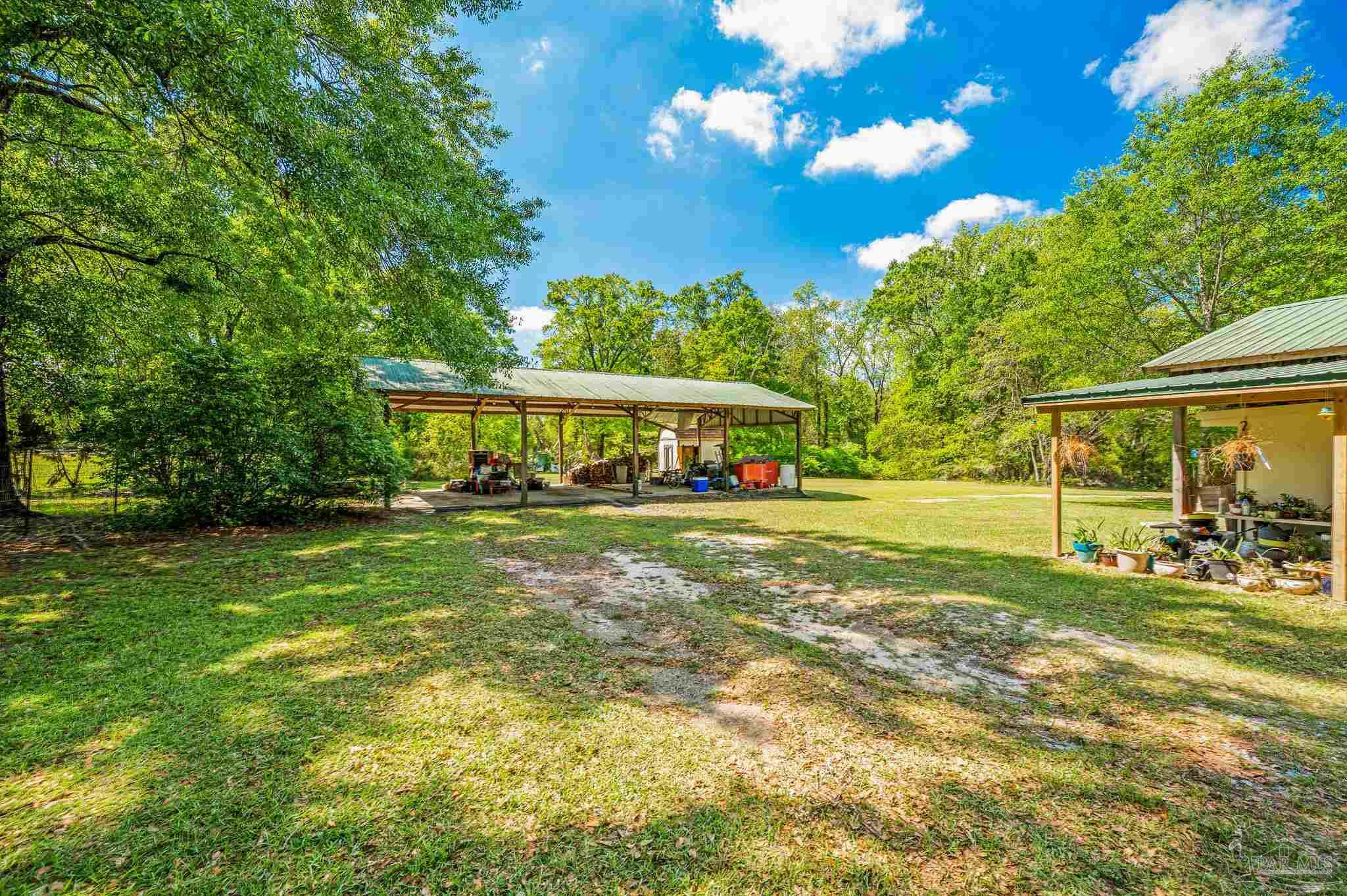 3015 Molino Road Molino, FL 32577 - Photo 4 of 35 a view of a house with a yard