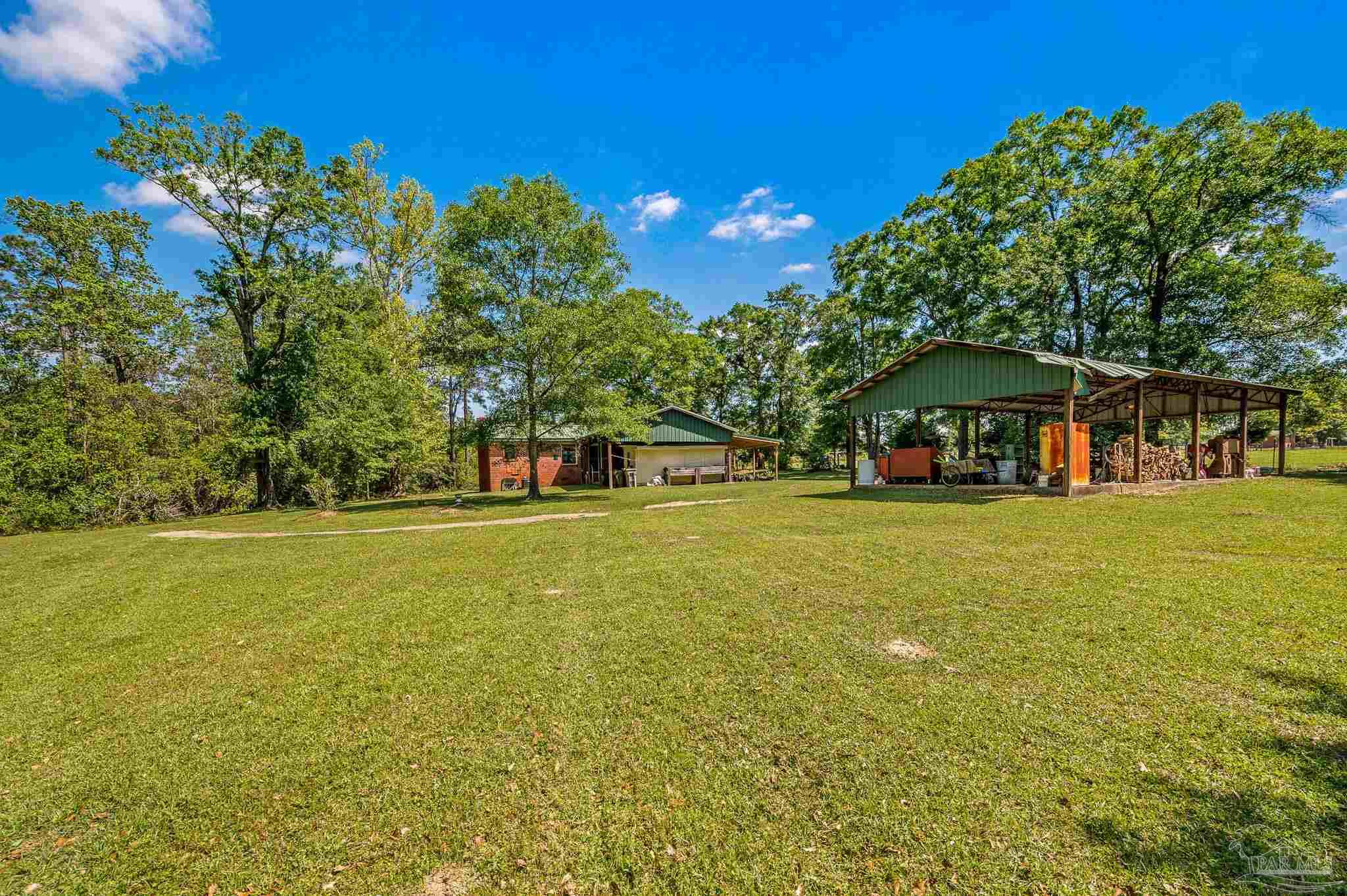 3015 Molino Road Molino, FL 32577 - Photo 5 of 35 a view of a house with a yard