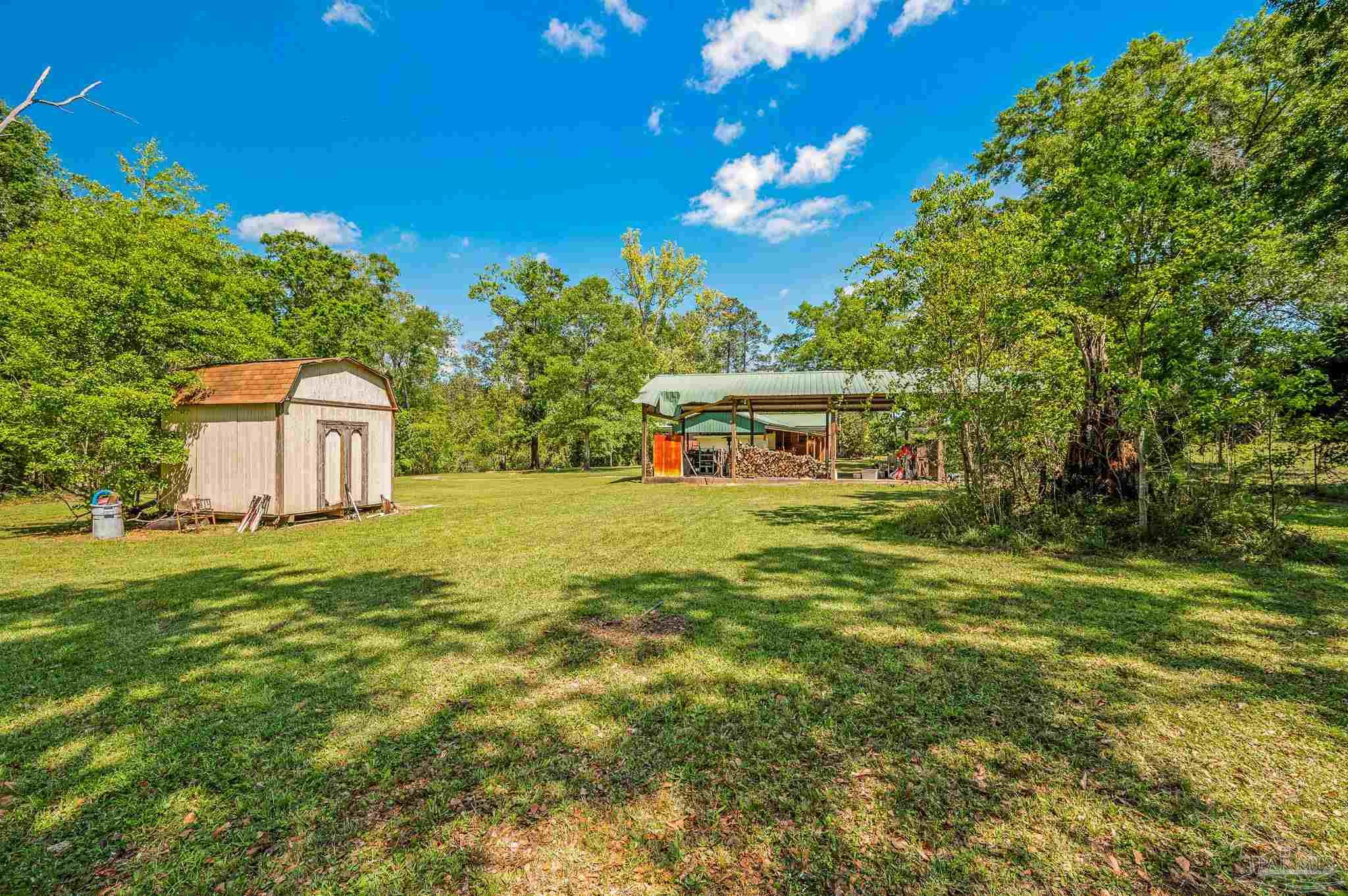 3015 Molino Road Molino, FL 32577 - Photo 10 of 35 a view of a house with a yard