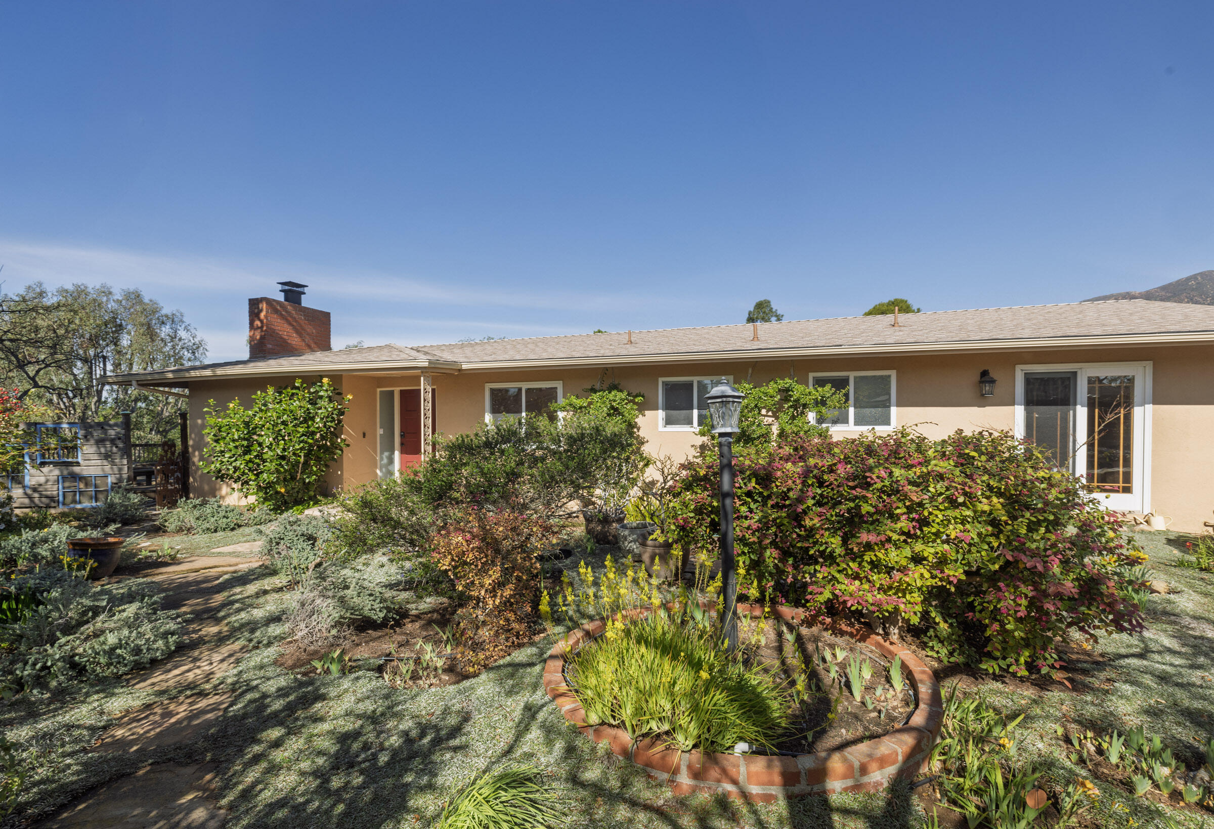 1005 Winther Way Santa Barbara, CA 93110 - Photo 1 of 33 a front view of a house with a yard