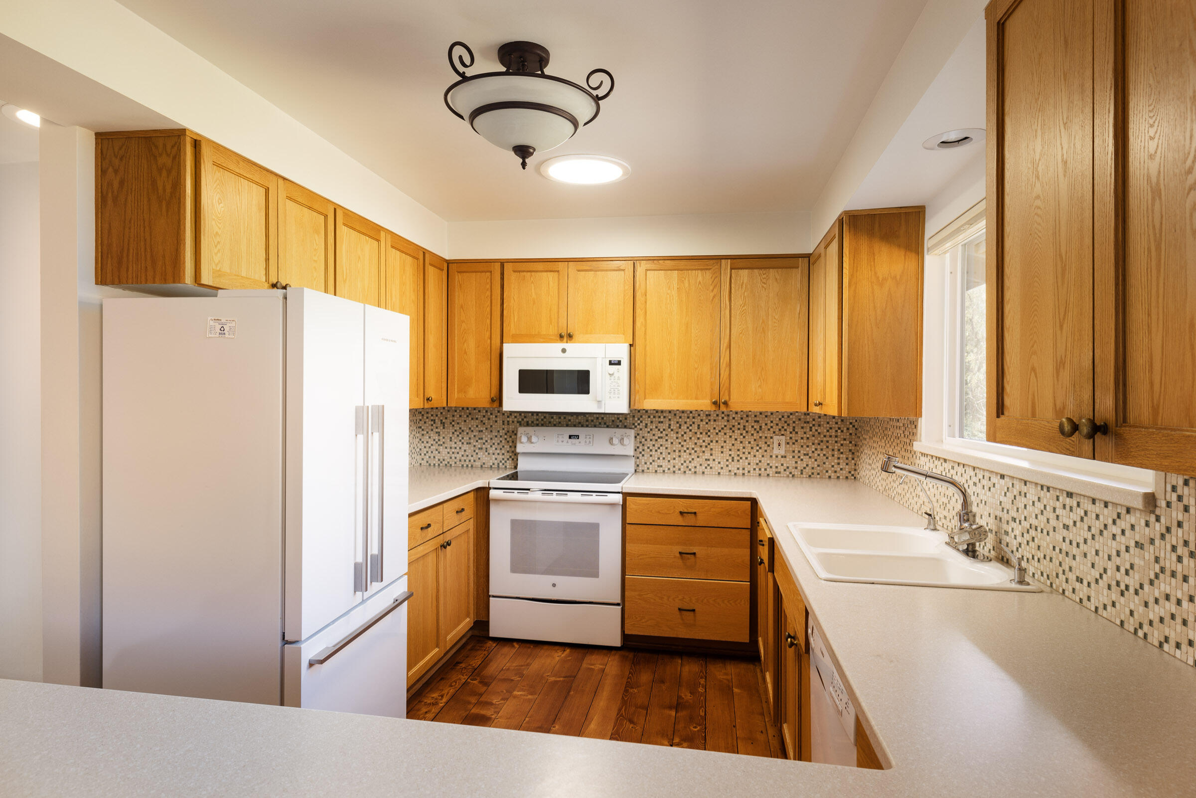 1005 Winther Way Santa Barbara, CA 93110 - Photo 12 of 33 a kitchen with stainless steel appliances granite countertop a sink stove and refrigerator