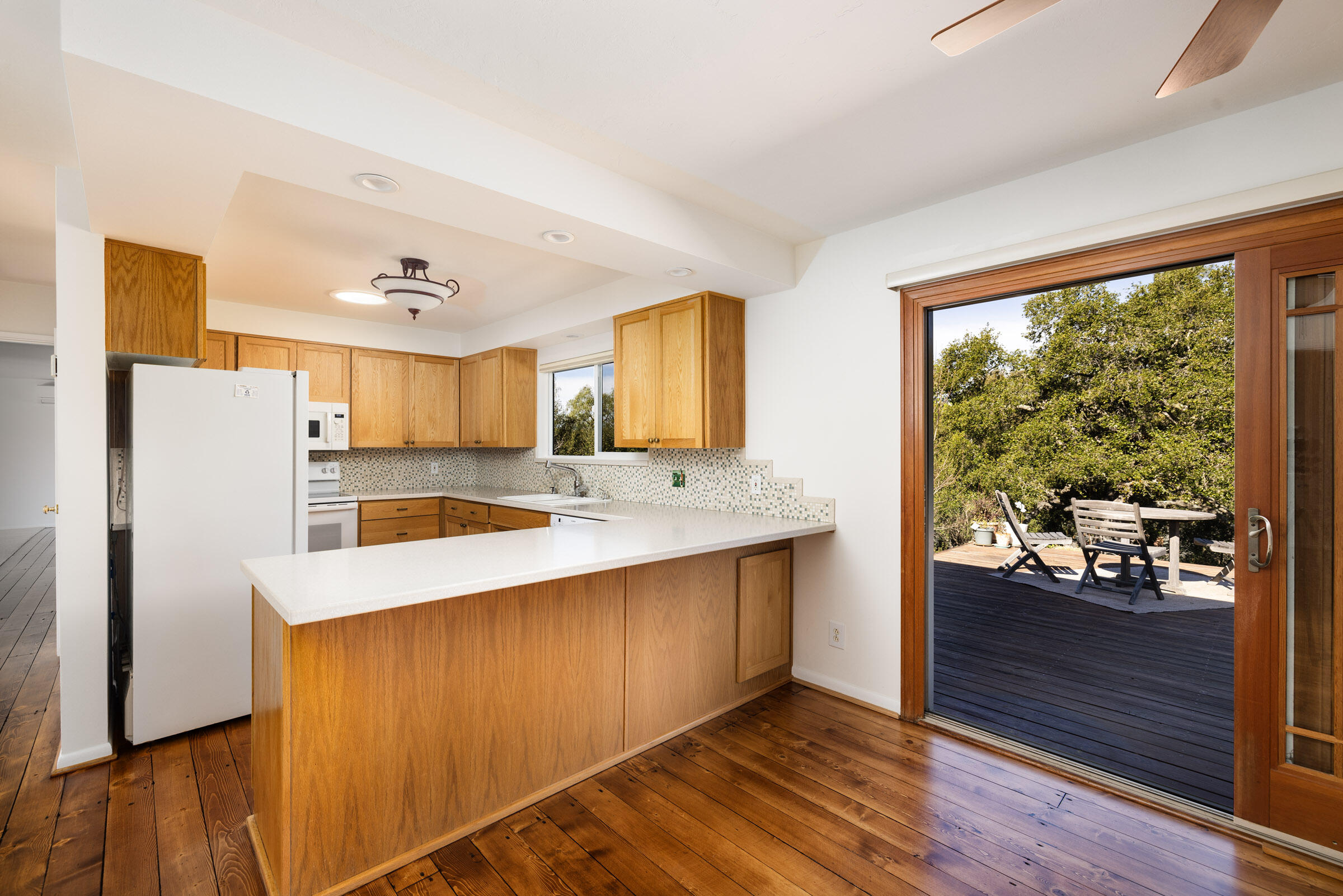 1005 Winther Way Santa Barbara, CA 93110 - Photo 15 of 33 a kitchen with a sink a refrigerator and wooden floor