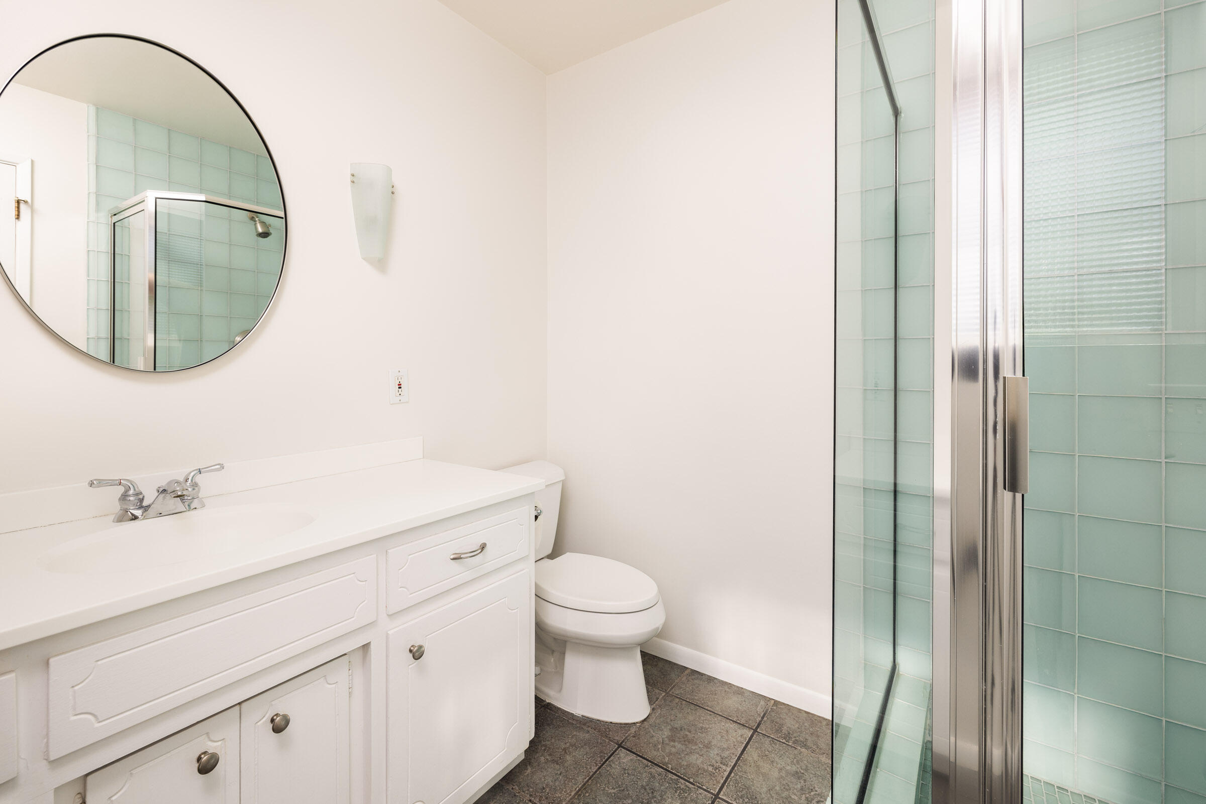 1005 Winther Way Santa Barbara, CA 93110 - Photo 17 of 33 a bathroom with a sink a toilet and a mirror