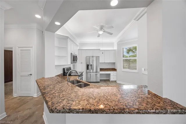 a living room with furniture a large window
