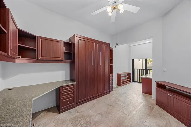 a living room with furniture and a dresser