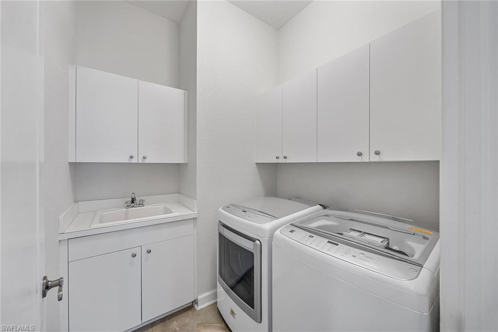 2432 Ravenna Boulevard, Unit 201 Naples, FL 34109 - Photo 27 of 49 a view of washer and dryer