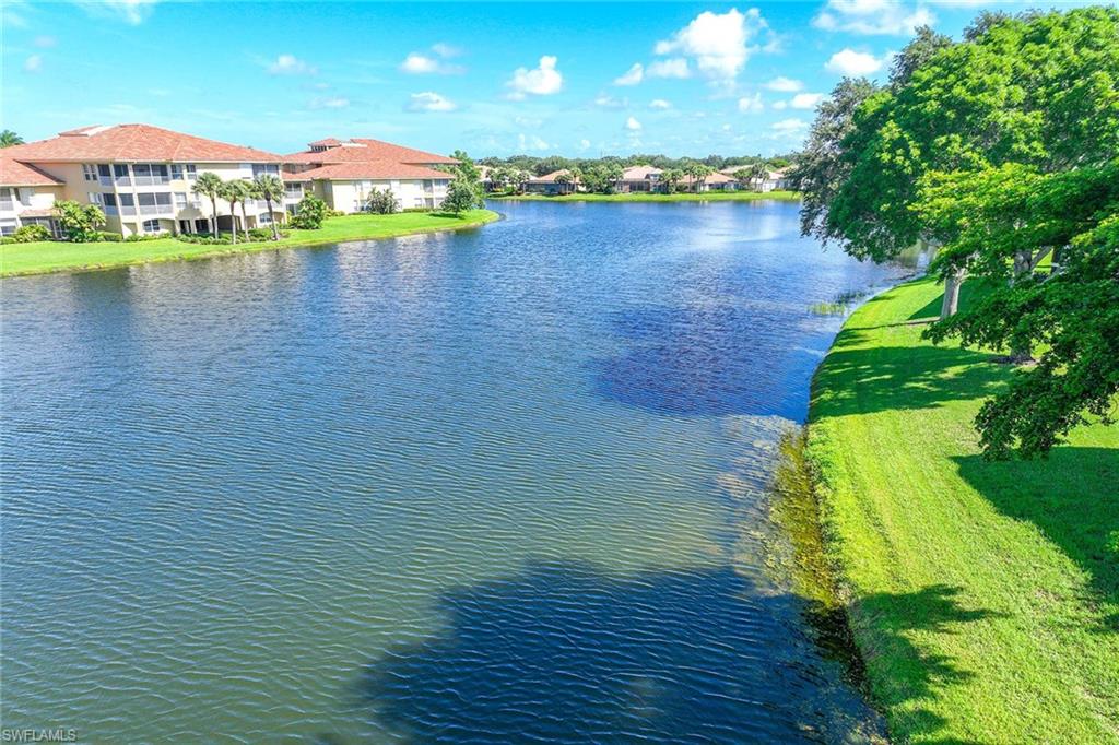 2432 Ravenna Boulevard, Unit 201 Naples, FL 34109 - Photo 33 of 49 a view of a lake in front of house