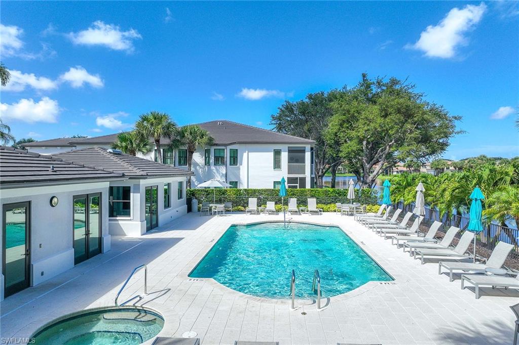 2432 Ravenna Boulevard, Unit 201 Naples, FL 34109 - Photo 41 of 49 a house with swimming pool in front of it