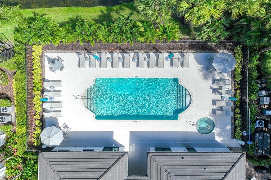 2432 Ravenna Boulevard, Unit 201 Naples, FL 34109 - Photo 42 of 49 a view of table and chairs in patio