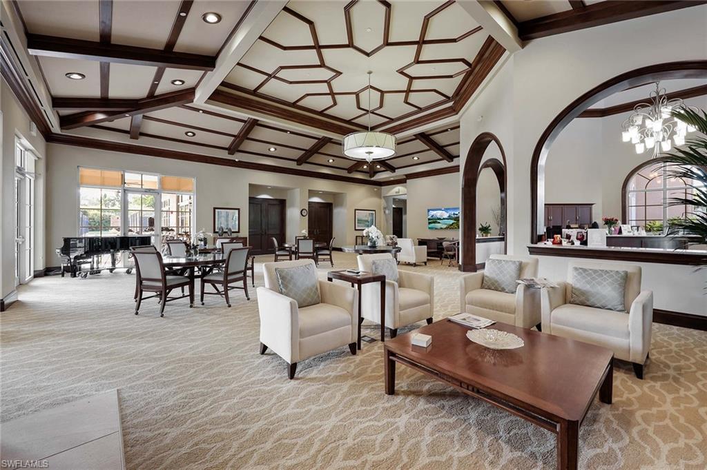 2432 Ravenna Boulevard, Unit 201 Naples, FL 34109 - Photo 46 of 49 a living room with furniture and wooden floors