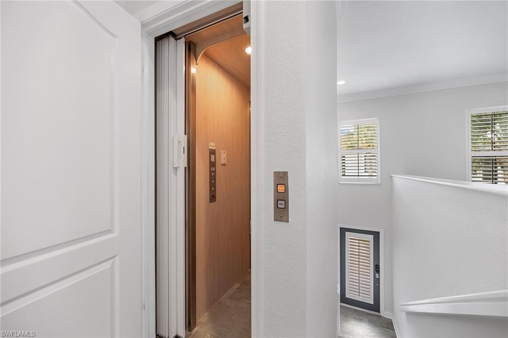 2432 Ravenna Boulevard, Unit 201 Naples, FL 34109 - Photo 9 of 50 a view of front door with hallway
