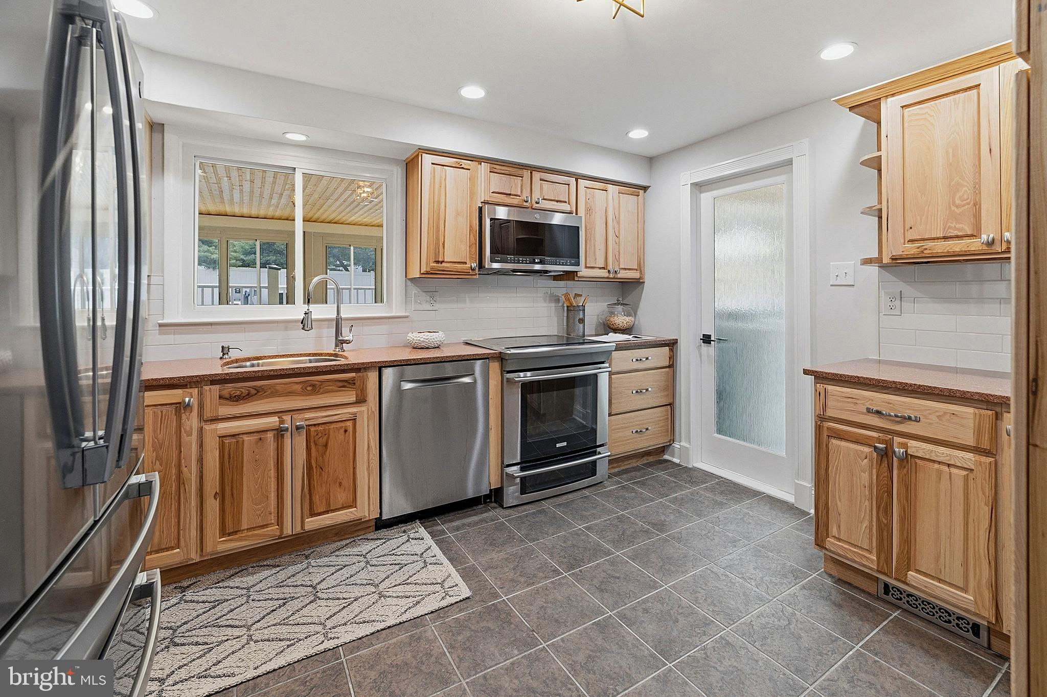 117 Harvest Road Cherry Hill, NJ 08002 - Photo 12 of 35 a kitchen with a stove sink and microwave