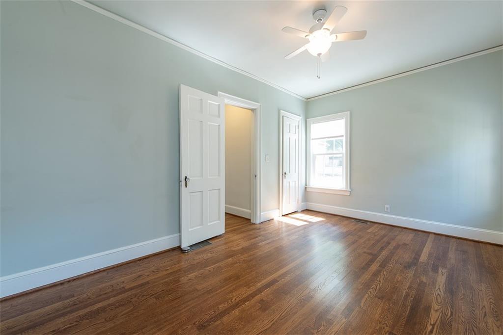 208 Shadowmoor Drive, Unit 208 Decatur, GA 30030 - Photo 14 of 29 a view of an empty room with window and wooden floor