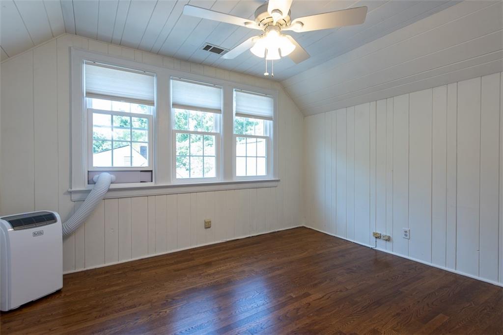 208 Shadowmoor Drive, Unit 208 Decatur, GA 30030 - Photo 21 of 29 a view of an empty room with wooden floor and a window