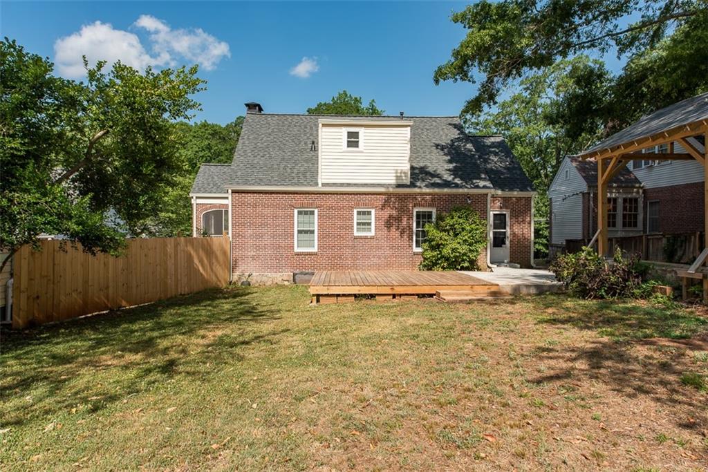 208 Shadowmoor Drive, Unit 208 Decatur, GA 30030 - Photo 27 of 29 a view of a house with a yard and large tree