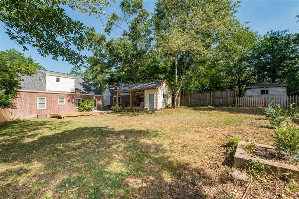 208 Shadowmoor Drive, Unit 208 Decatur, GA 30030 - Photo 28 of 29 a front view of a house with a yard