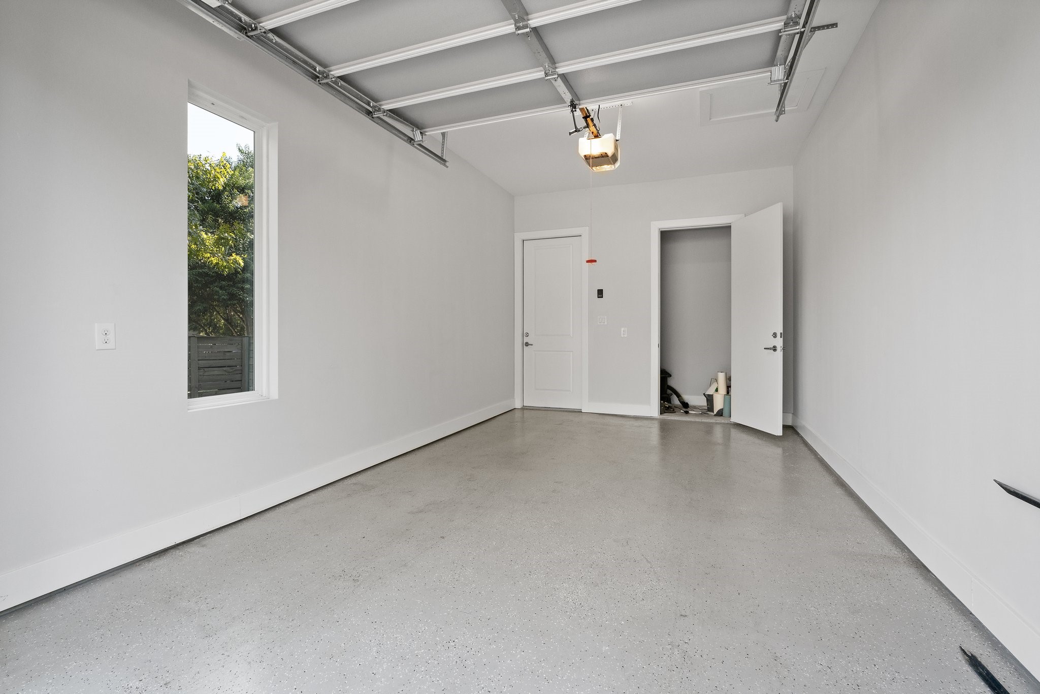 7217 Blessing Avenue, Unit A Austin, TX 78752 - Photo 17 of 22 Garage with epoxy floors and large interior storage room.