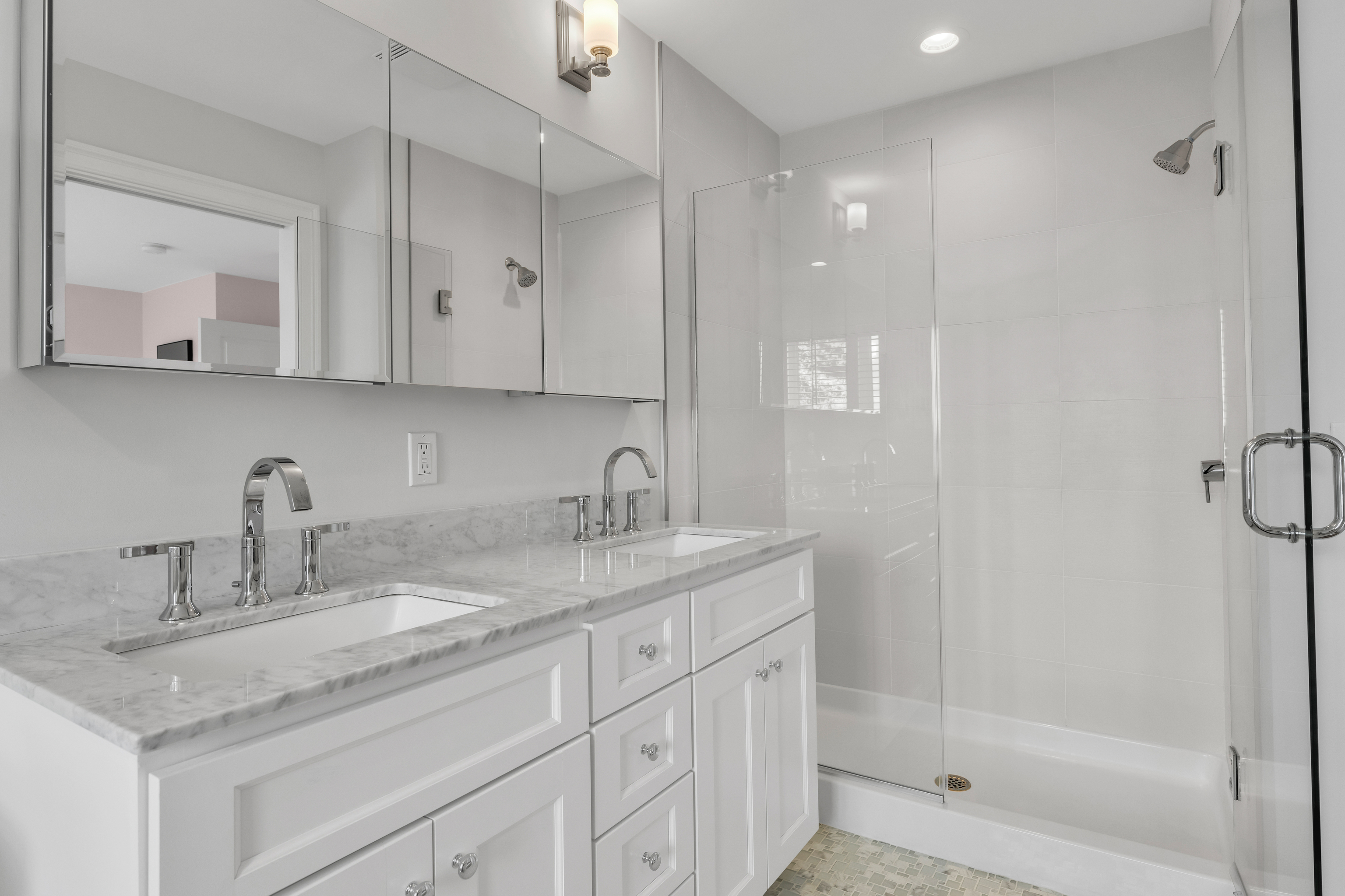 610 Marina Way Landing, Unit 610 Westbrook, CT 06498 - Photo 29 of 40 a bathroom with a granite countertop sink a mirror and a shower