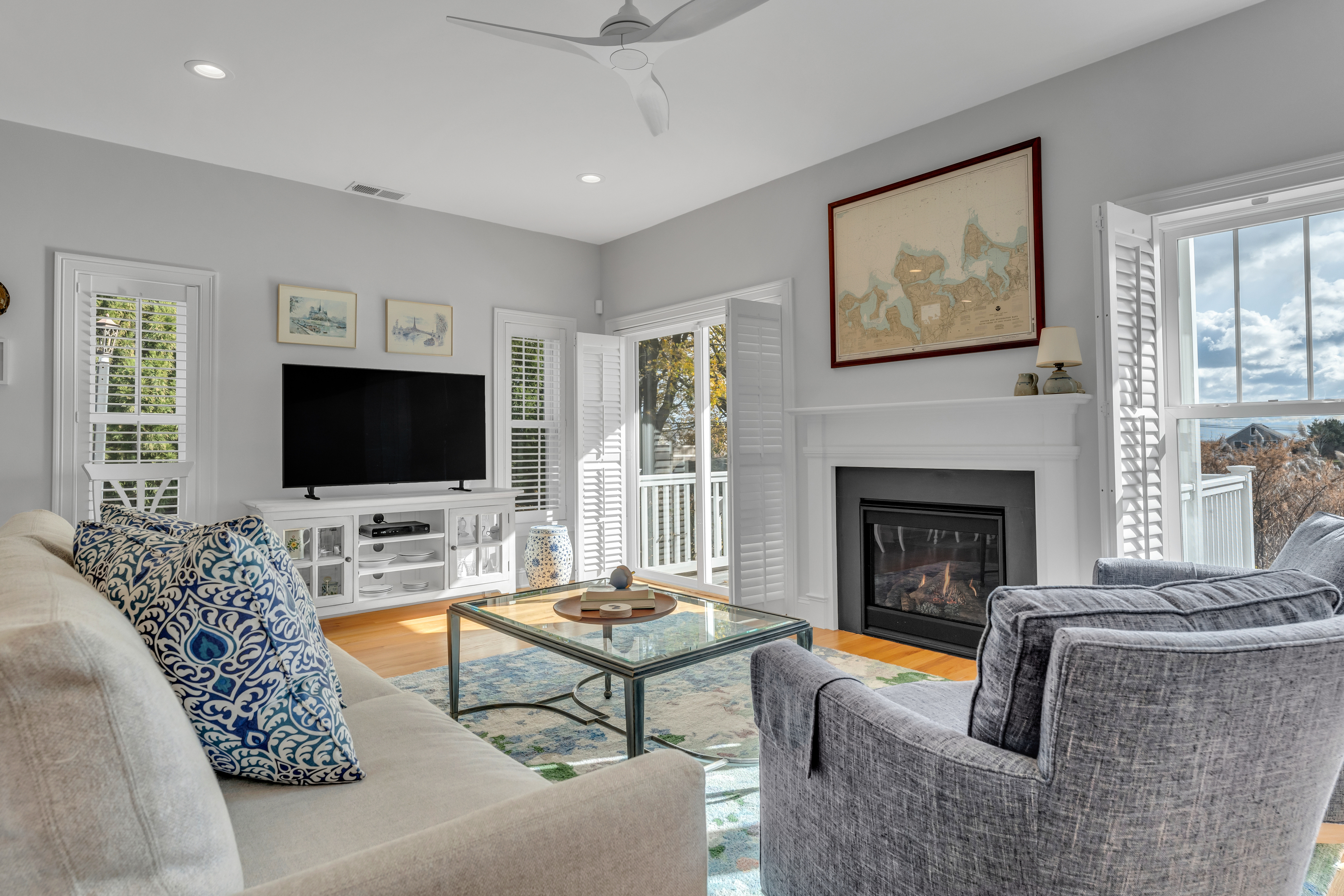 610 Marina Way Landing, Unit 610 Westbrook, CT 06498 - Photo 10 of 40 a living room with furniture a flat screen tv and a fireplace