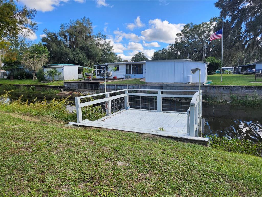 10129 East Bass Circle Inverness, FL 34450 - Photo 19 of 34 a view of a house with a yard