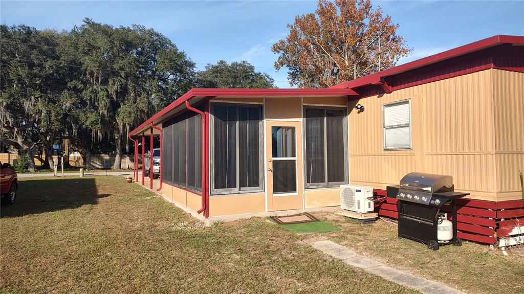 10129 East Bass Circle Inverness, FL 34450 - Photo 27 of 34 a view of a house with a outdoor space