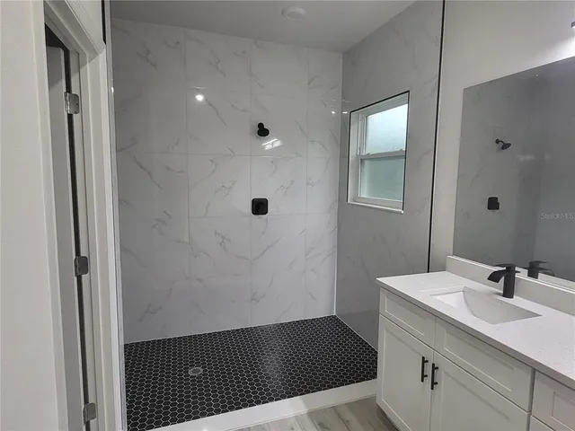 a bathroom with a sink and a mirror