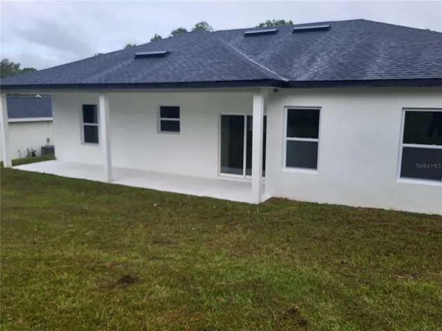 a house with garden in front of it