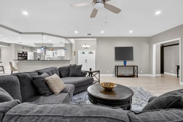 a kitchen with stainless steel appliances kitchen island granite countertop a sink and cabinets