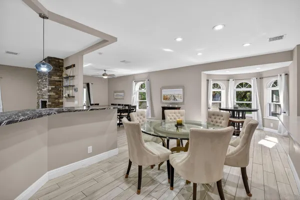 a view of a dining room with furniture and a fireplace